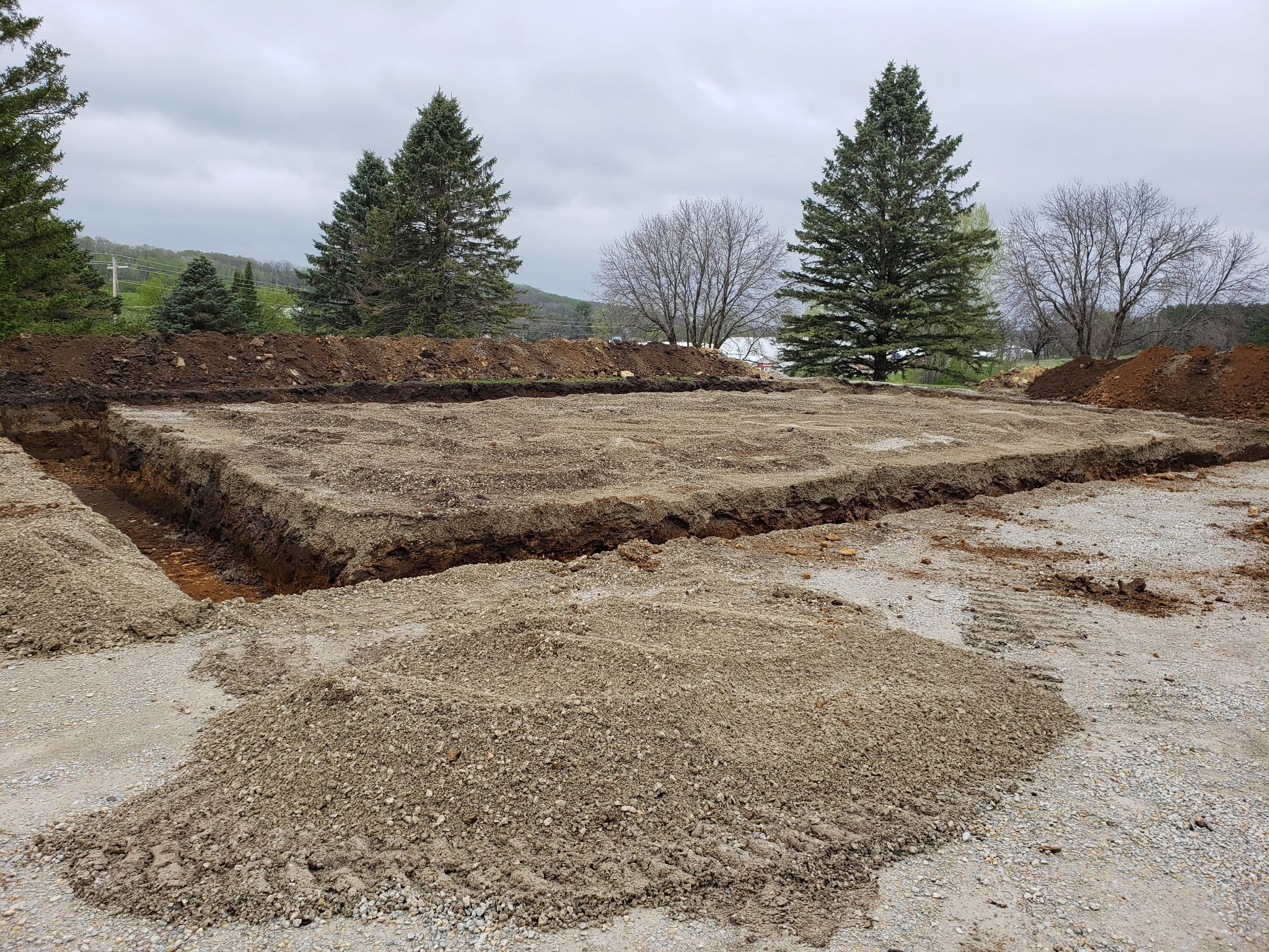 Before: Initial excavation and site preparation for garage foundation